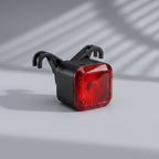 Luce posteriore ricaricabile smart store.pin.bike con sensore automatico, design compatto nero e lente rossa